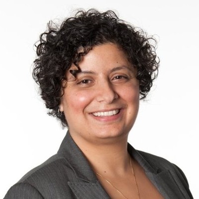 Rana Kanaan smiles for a professional headshot against a white background