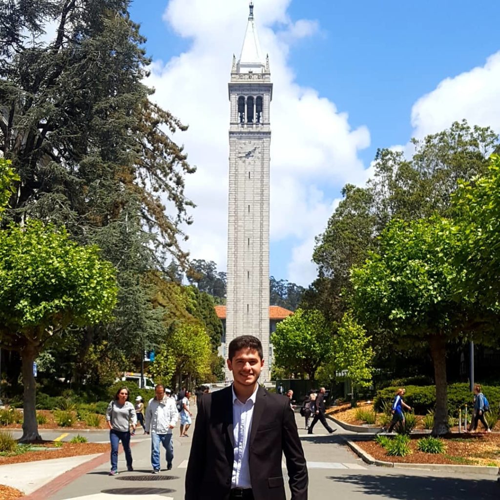 Marcelo Dias standing in front of Sather Tower