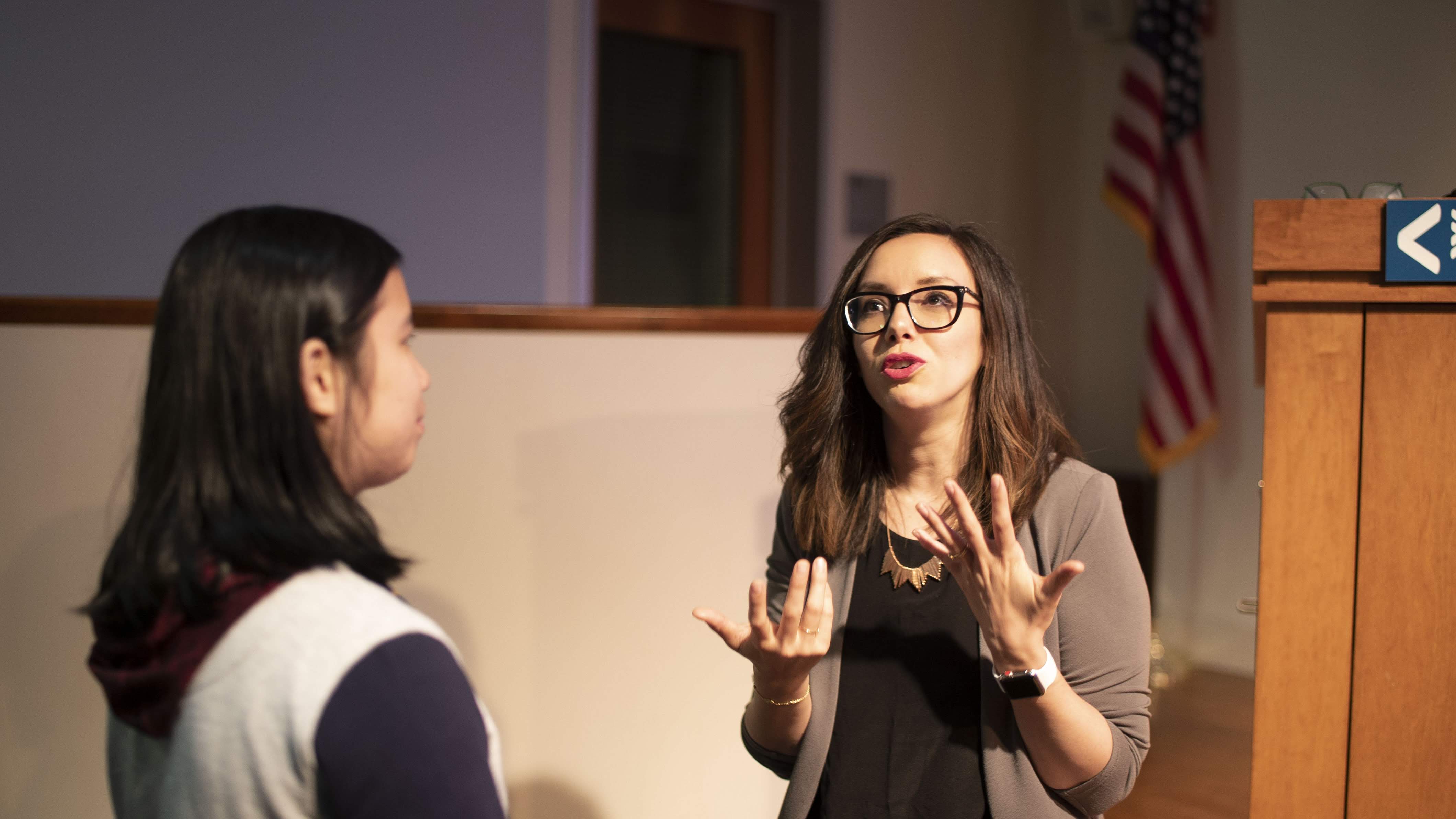 Claire Vo, VP of Product at Optimizely, speaks with a student after her talk at SCET's BMoE Bootcamp.