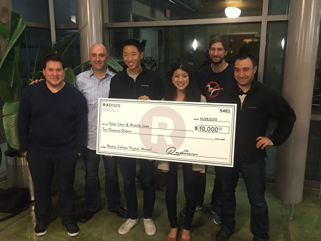 Picture of the winners, Michelle Leon and Victor Chen, from the team ‘Our Data is Bigger than Yours’ receiving a $10,000 check from Radius’ Data Engineering team.