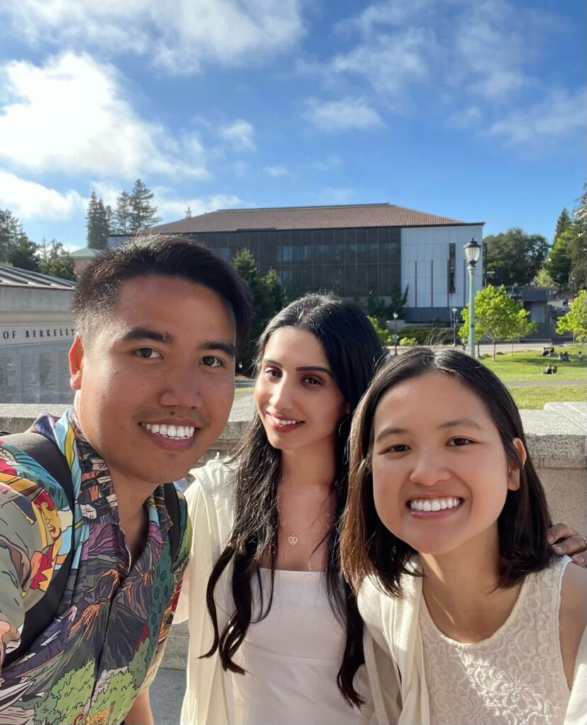 The AlkeLink team members smile together in a selfie in front of Memorial Glade on the UC Berkeley campus 