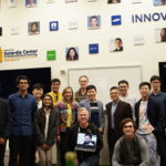 Global Program Director and judges (center) with the winning teams at the Pitch Contest