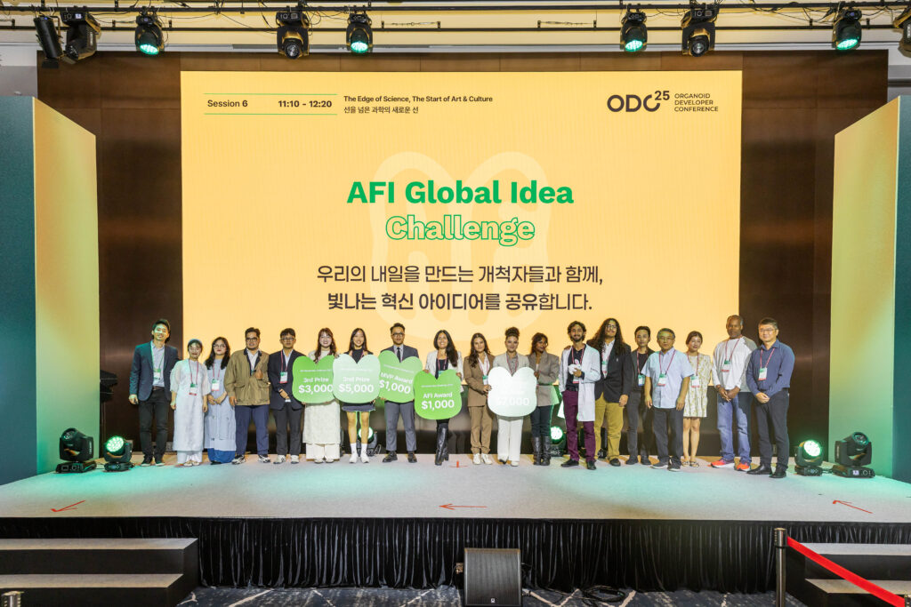 The winners of the AFI Global Idea Challenge stand on stage with their awards for a group picture.