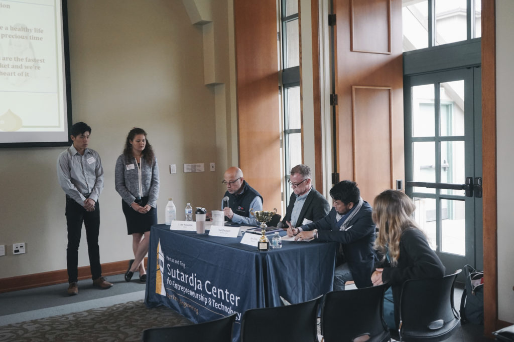 Two UC Berkeley students present their meal replacement powder, MIX, to judges at the Sutardja Center for Entrepreneurship and Technology's Collider Cup